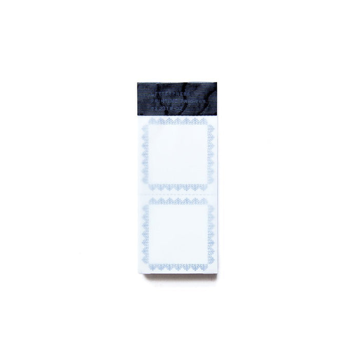 a packet of small book labels with two perforated labels per sheet
