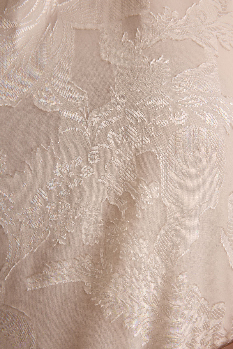 Liora Ivory Jacquard Halter Top shown in a complementary styling arrangement.