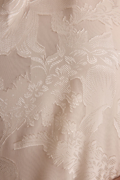 Liora Ivory Jacquard Halter Top shown in a complementary styling arrangement.