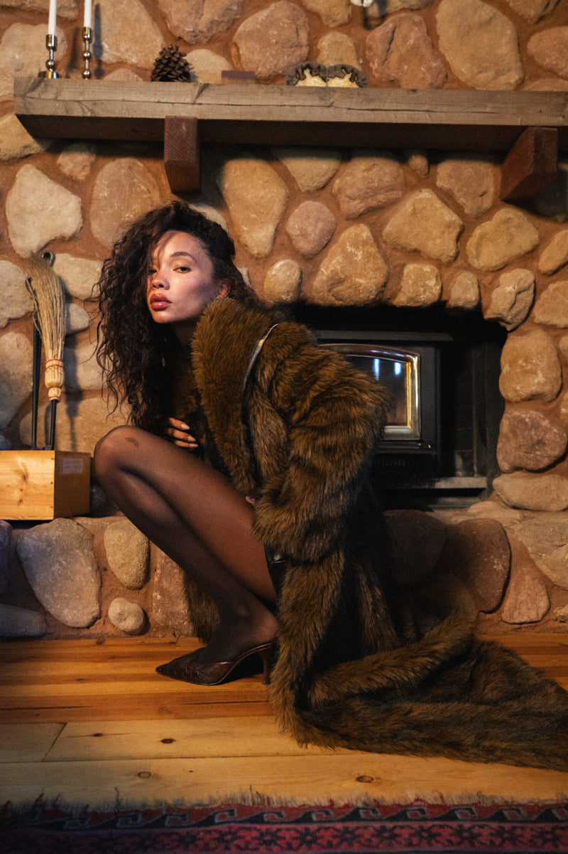 Back view of the brown faux fur jacket showing the silhouette and fit.