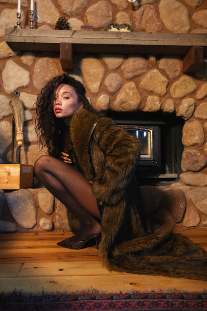 Back view of the brown faux fur jacket showing the silhouette and fit.