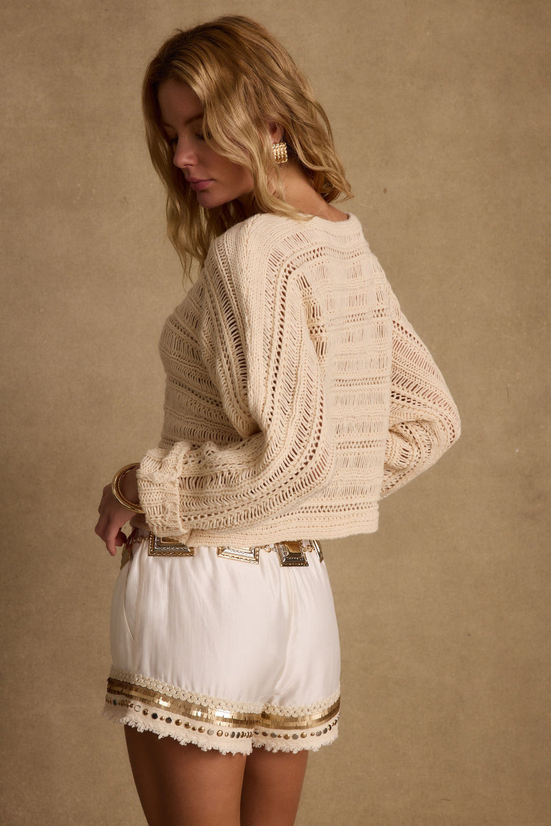 Marela Cream Crochet Sweater styled in a complete look from an alternate angle.