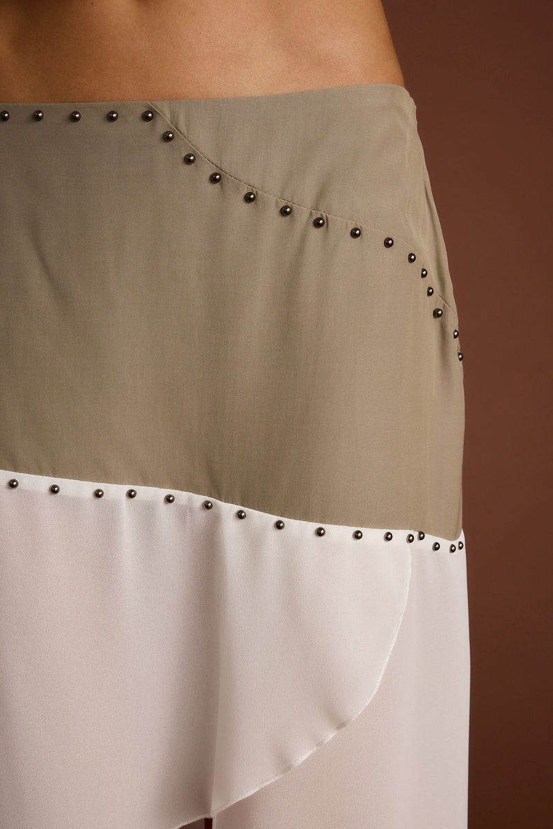 Full-length view of the midi skirt showing the drape and movement.