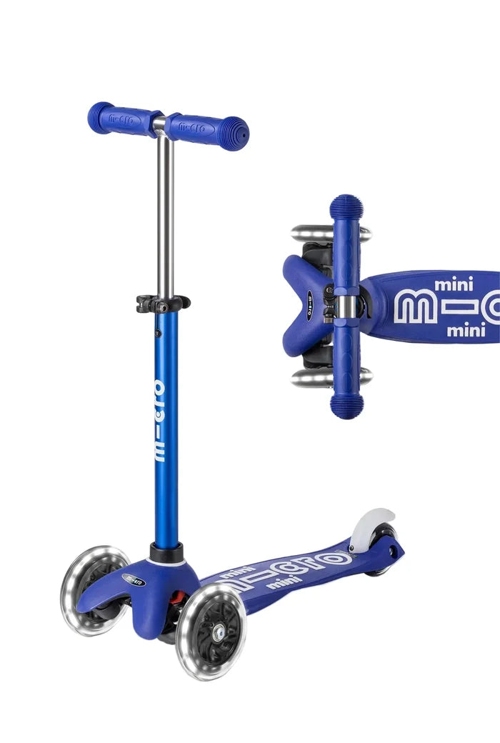 Blue scooter with handlebar attachment on a white background