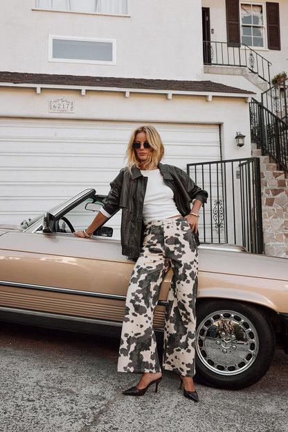 Pants with elegant accents, a cow print pants standout.