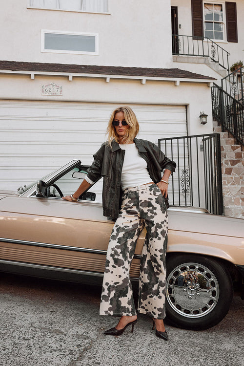 Pants with elegant accents, a cow print pants standout.