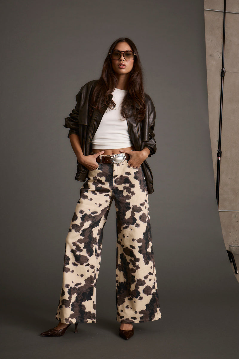 Lifestyle shot of the pants styled for day-to-night versatility.