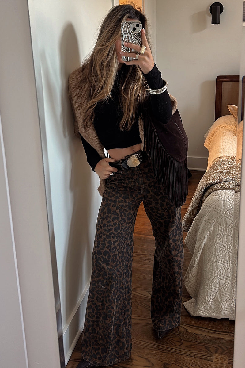 Leopard print pants with elegant accents, a leopard pants standout.