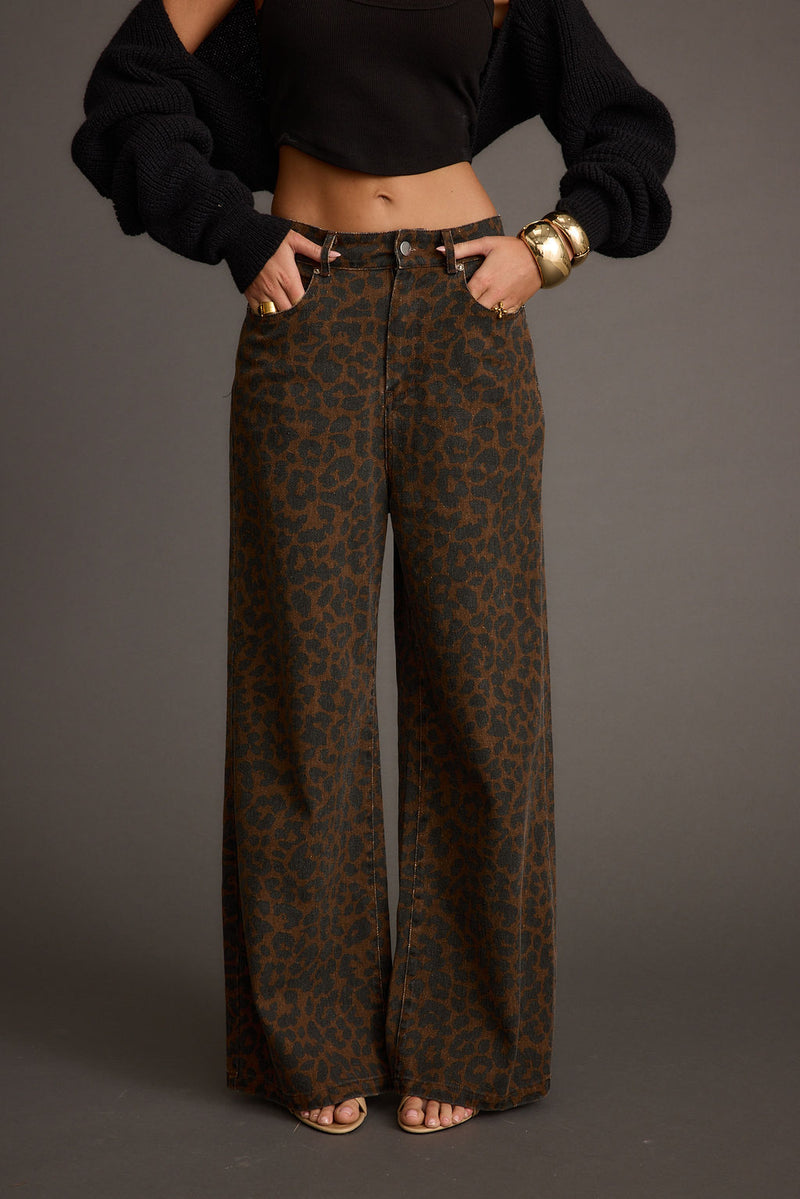 Back view of the leopard print pants showing the silhouette and fit.