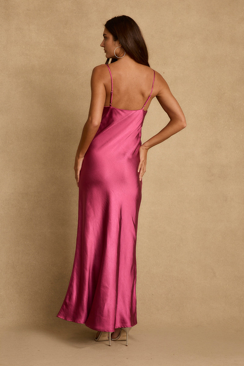 Back view of fuchsia satin maxi dress with thin straps and low open back.