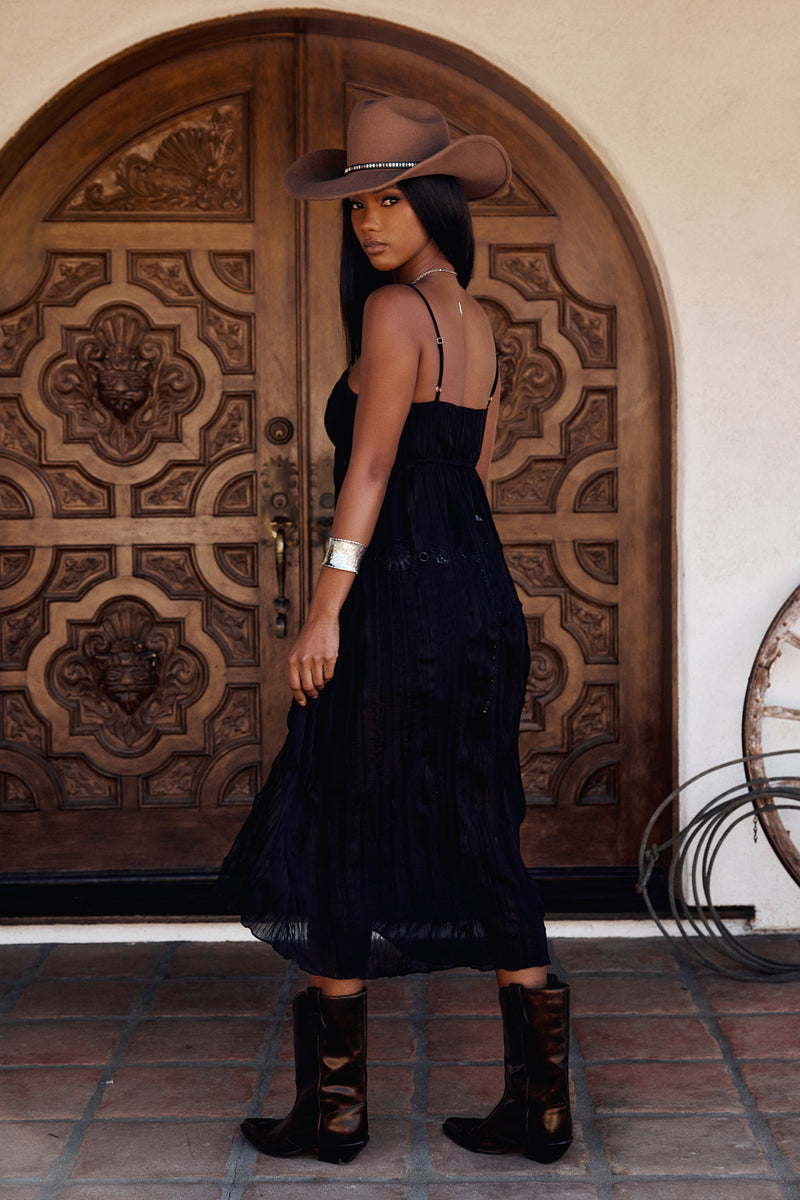 Back view of the black top showing the silhouette and fit.