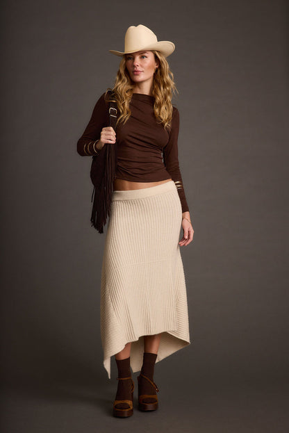 Cream skirt with refined detailing and a flattering silhouette.