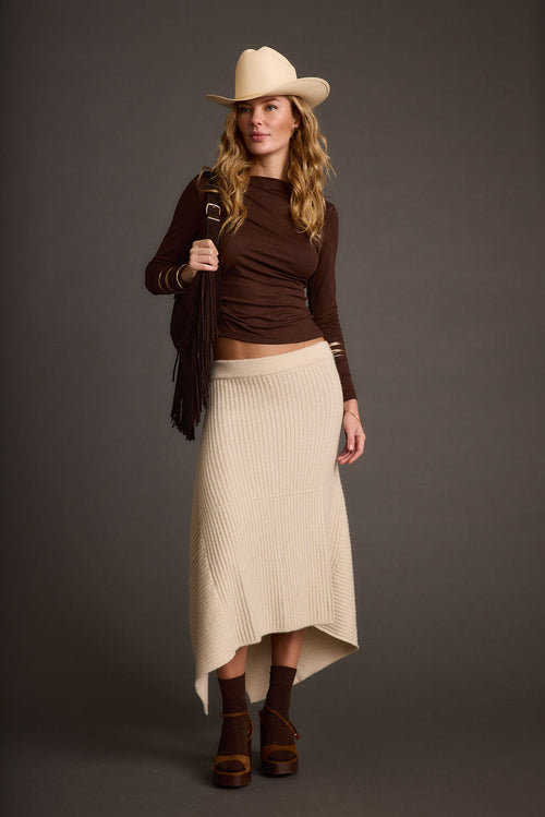 Cream skirt with refined detailing and a flattering silhouette.