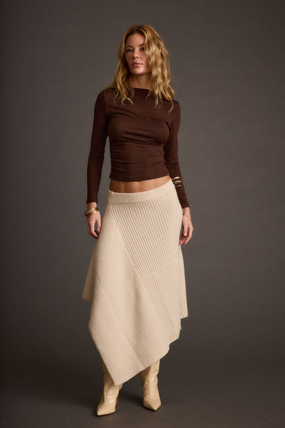 Mod Cream Asymmetrical Skirt paired with complementary accessories for a polished look.