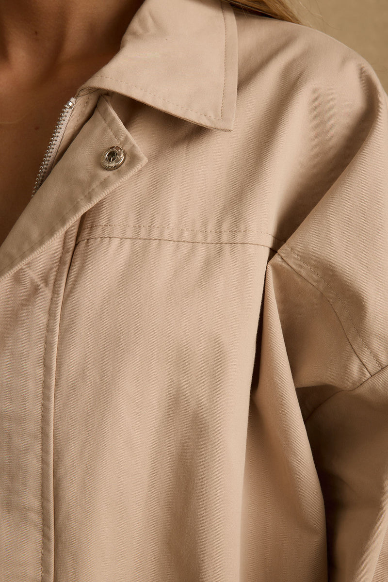 Lifestyle shot of the khaki jacket styled for day-to-night versatility.