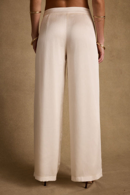 Moonlit Kiss Cream Satin Trousers paired with complementary accessories for a polished look.