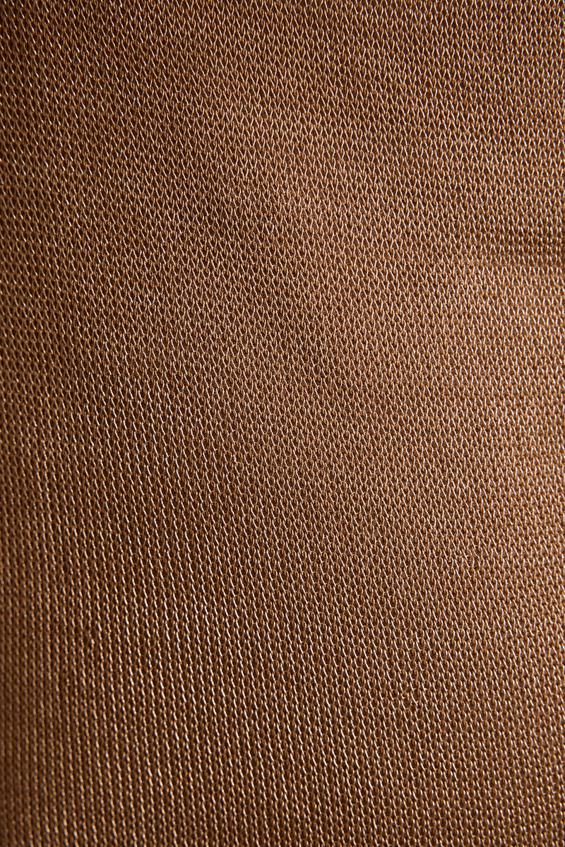 Close-up of rose gold lurex top fabric showing delicate metallic mesh weave texture.