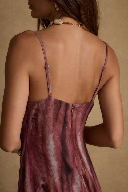 Lifestyle shot of the berry maxi dress styled for day-to-night versatility.