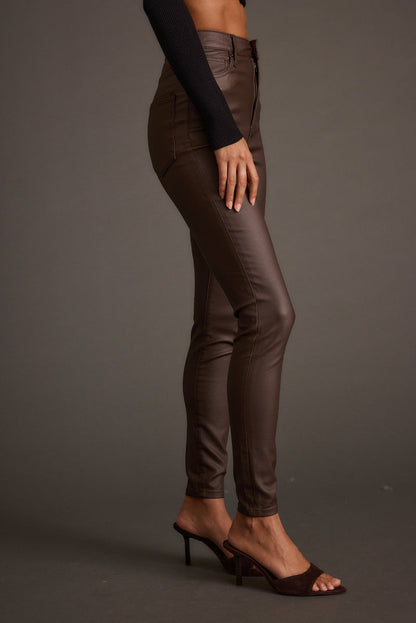 Close-up of the Nixon Mocha Coated Pants showcasing the fabric texture and design details.