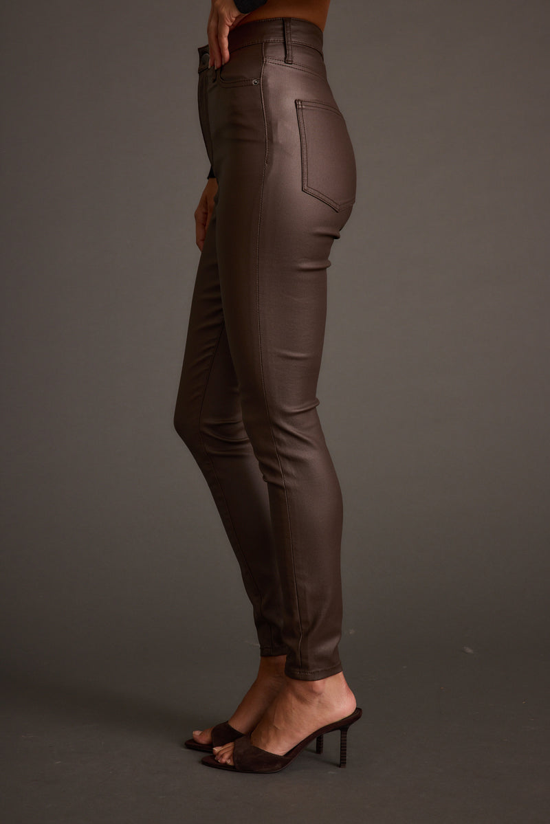 Nixon Mocha Coated Pants paired with complementary accessories for a polished look.