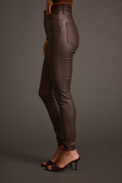Nixon Mocha Coated Pants paired with complementary accessories for a polished look.