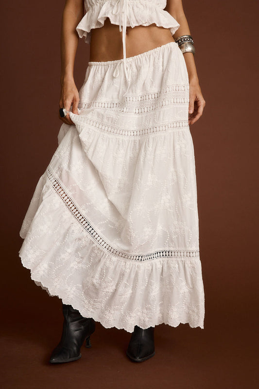 White embroidered maxi skirt with embroidered accents, a white lace skirt essential.