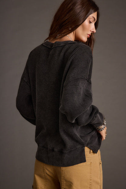 Detail shot of the Not Your Ex's Washed Black Waffle Knit Top highlighting the knit elements.