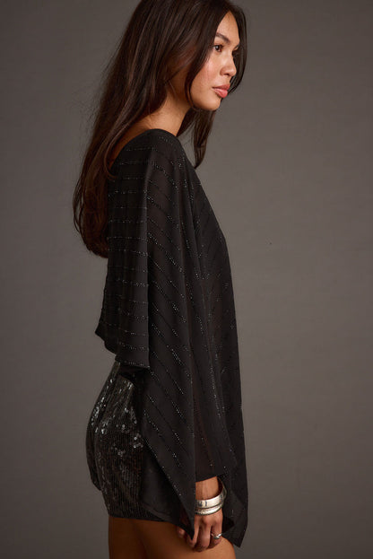 Detail shot of the Oasis Black Rhinestone Shawl highlighting the rhinestone elements.