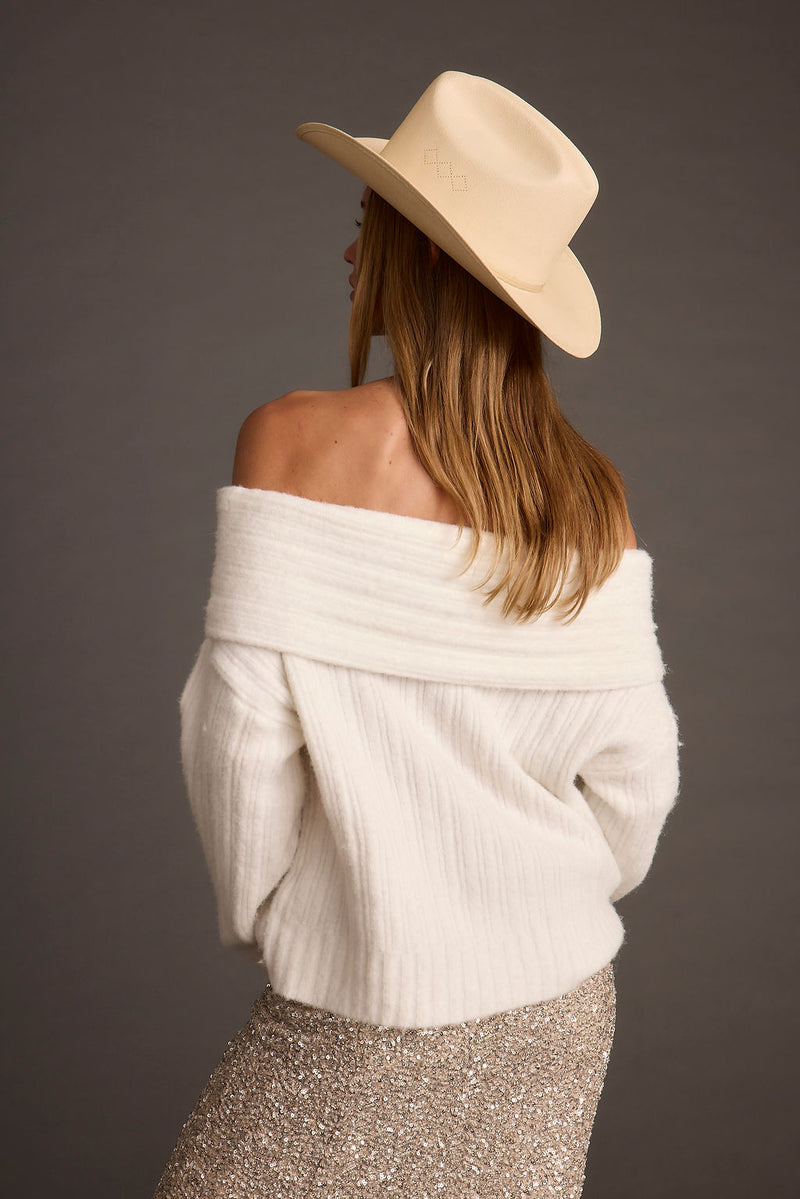 Close-up of the Pamela Ivory Off the Shoulder Sweater showcasing the fabric texture and design details.