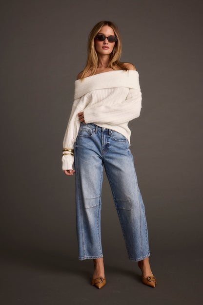 Detail shot of the Pamela Ivory Off the Shoulder Sweater highlighting the design elements.