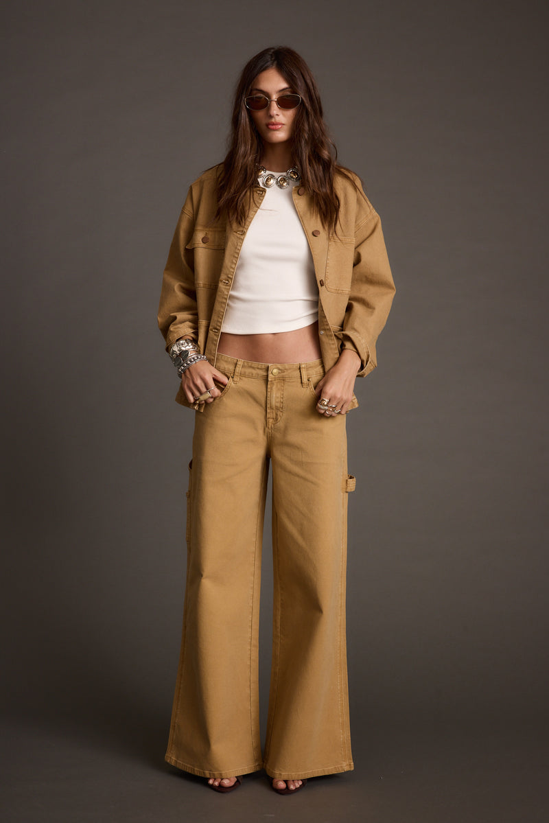 Khaki pants with refined detailing and a flattering silhouette.