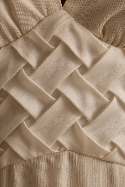 Woven basket-weave waist detail on the Penelope white halter resort midi dress.
