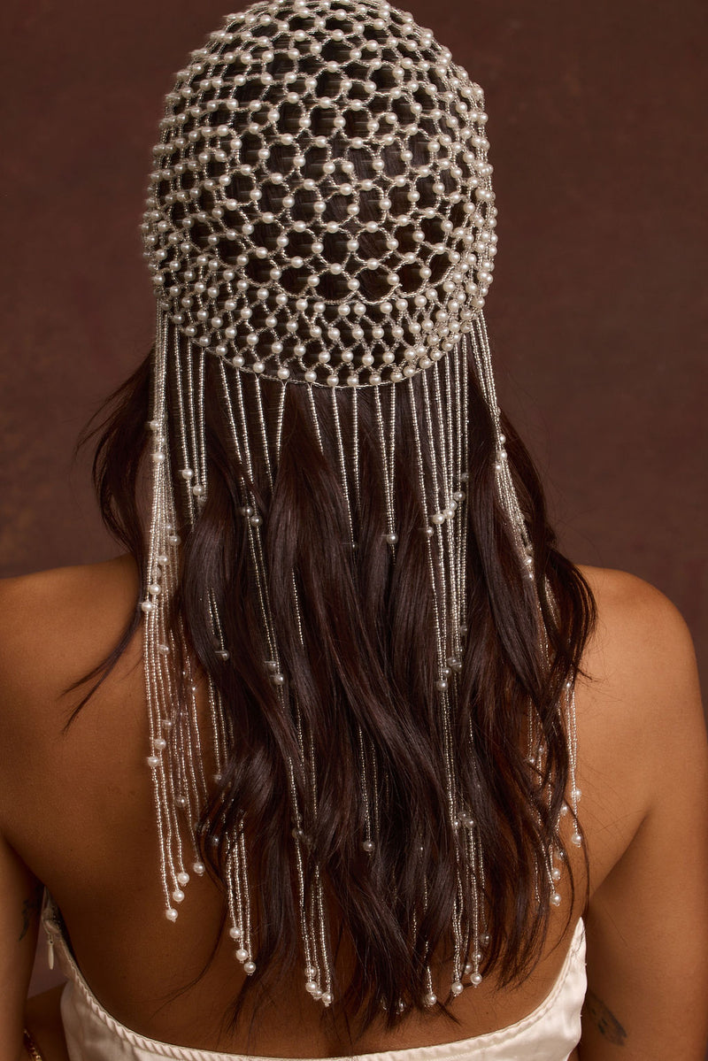 Close-up of the Polina Pearl Headpiece showcasing the pearl texture and craftsmanship.