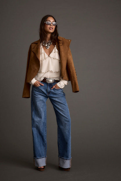 Lifestyle shot of the pants styled for day-to-night versatility.