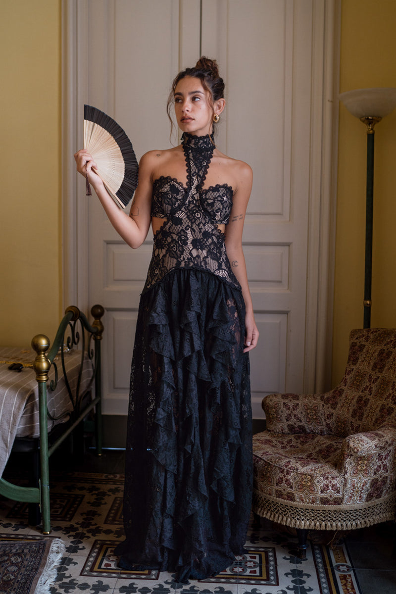 Alternate angle of the black maxi dress highlighting the overall design.