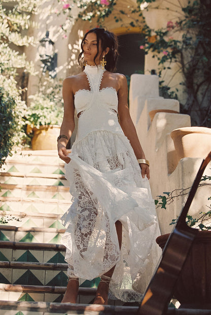 White lace drop-waist maxi dress with lace accents, a white drop waist dress essential.