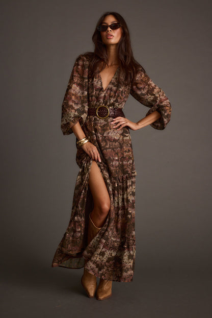 Floral maxi dress with elegant accents, a vacation maxi dress essential.