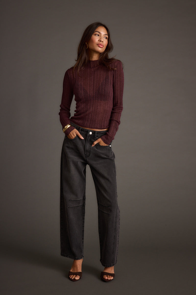 Close-up of the Rania Mulberry Mock Neck Top showcasing the fabric texture and design details.
