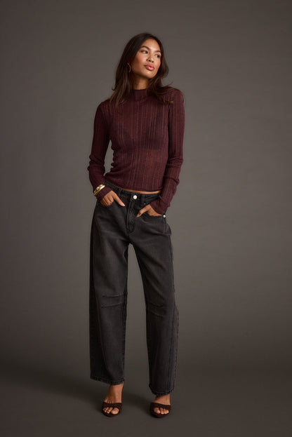 Close-up of the Rania Mulberry Mock Neck Top showcasing the fabric texture and design details.