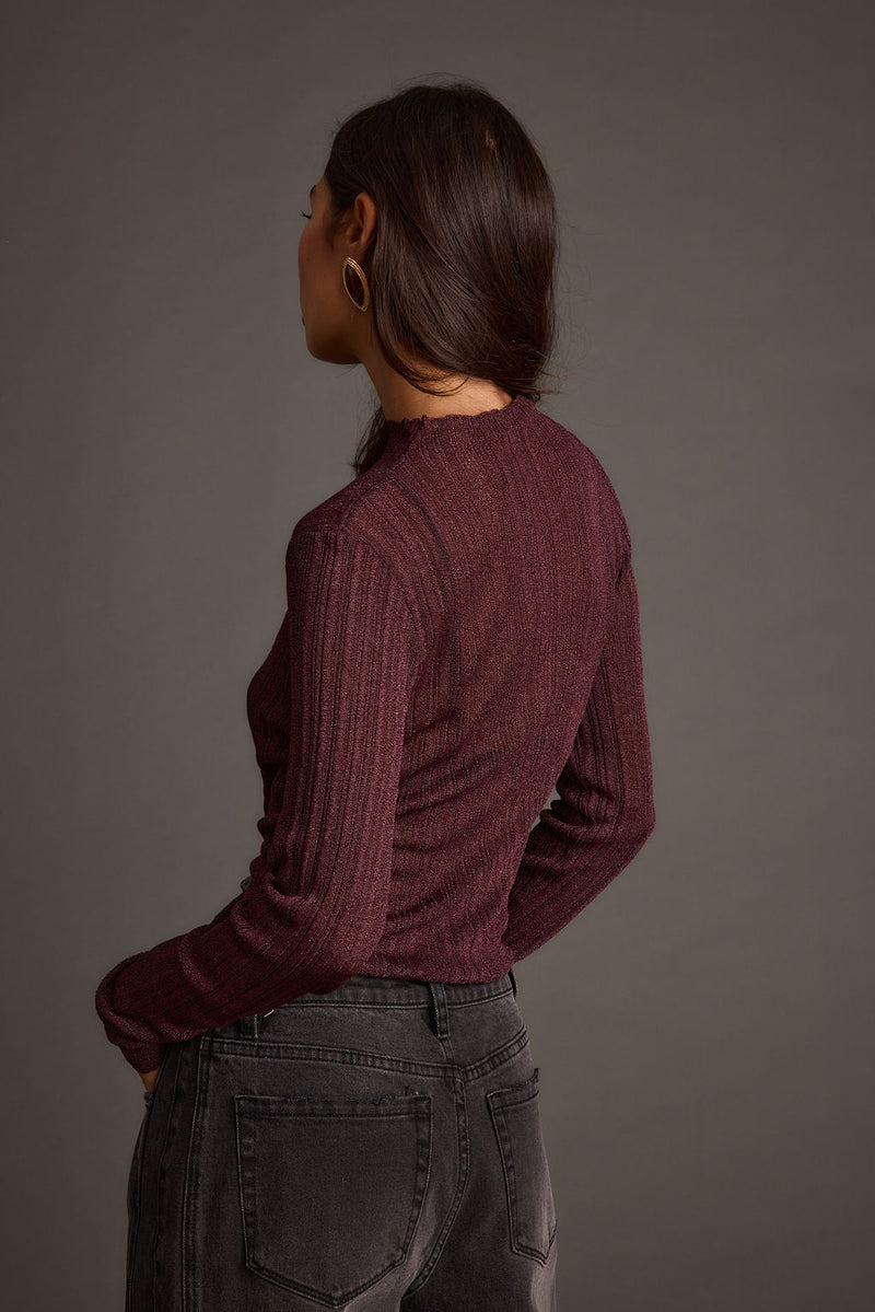 Full-length view of the top showing the drape and movement.