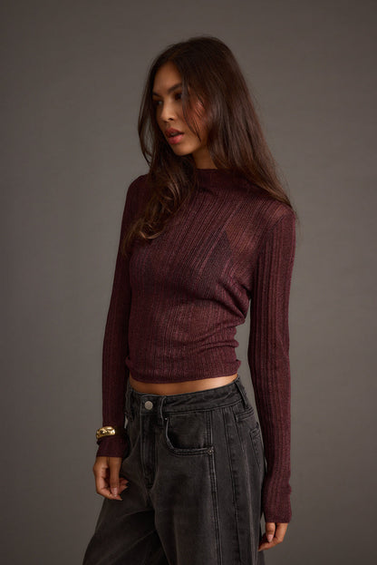 Detail shot of the Rania Mulberry Mock Neck Top highlighting the design elements.