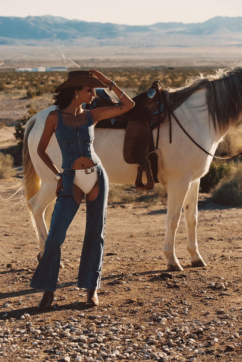 Close-up of the Revelry Studded Denim Chaps showcasing the denim texture and craftsmanship.
