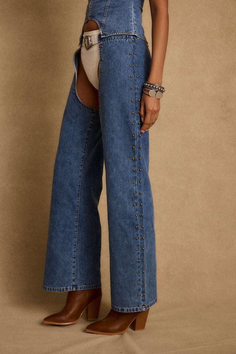 Revelry Studded Denim Chaps paired with complementary accessories for a polished look.