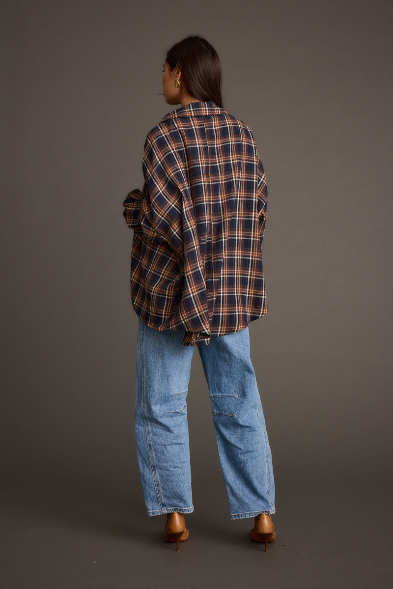 Back view of the navy piece showing the silhouette and fit.