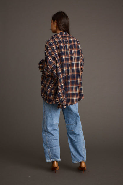 Back view of the navy piece showing the silhouette and fit.