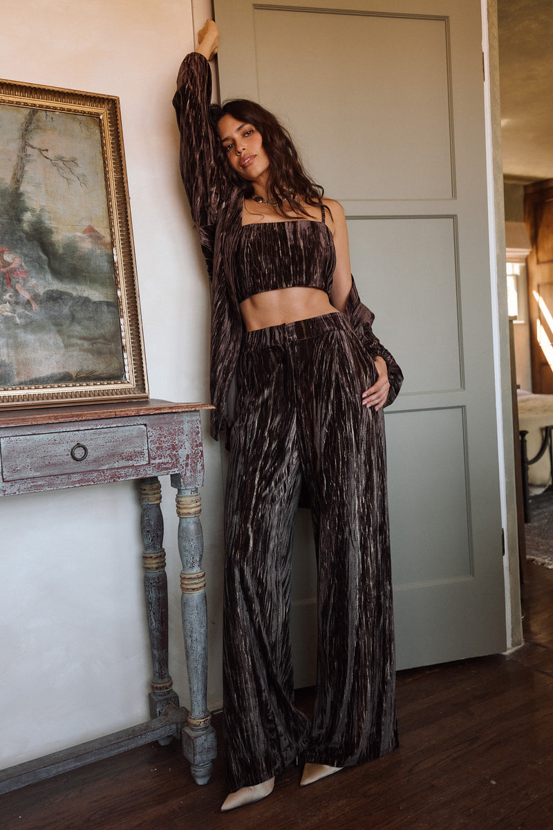Lifestyle shot of the espresso crop top styled for day-to-night versatility.