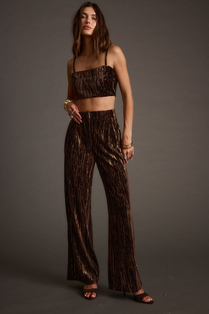 Espresso velvet trousers with refined detailing and a flattering silhouette.
