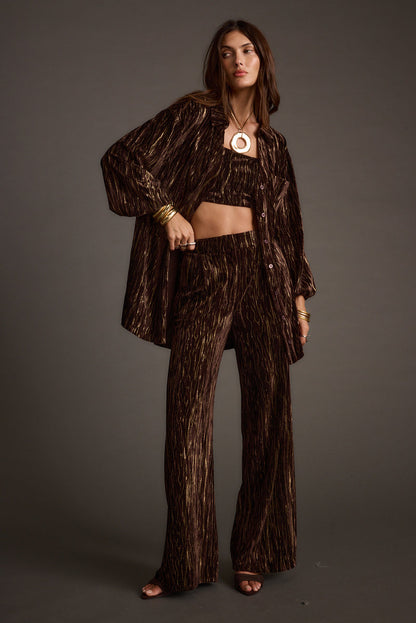 Close-up of the Rhea Espresso Velvet Trousers showcasing the velvet texture and craftsmanship.
