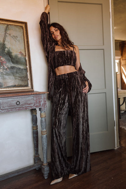 Rhea Espresso Velvet Trousers styled in a complete look from an alternate angle.