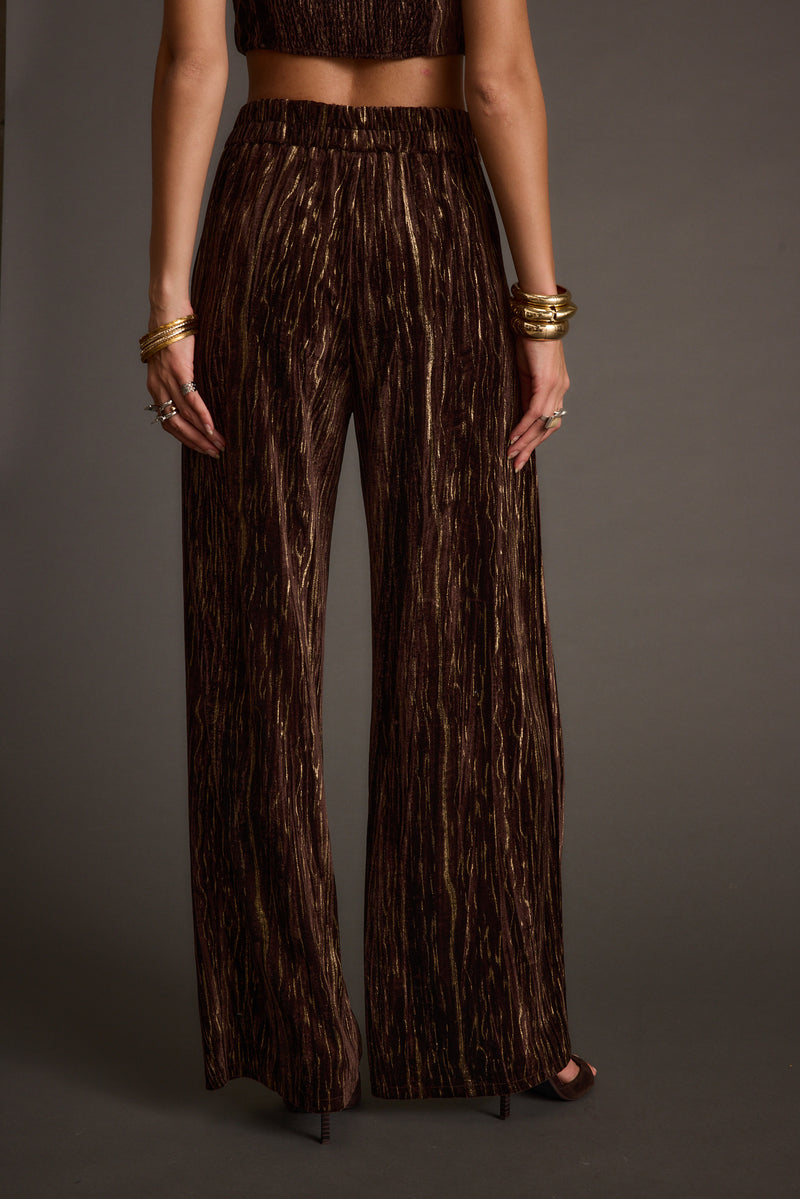 Rhea Espresso Velvet Trousers paired with complementary accessories for a polished look.